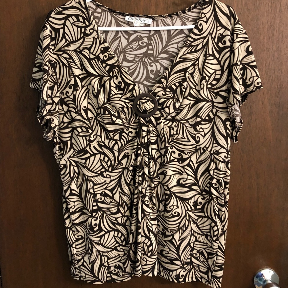 Women’s brow and cream colored top.